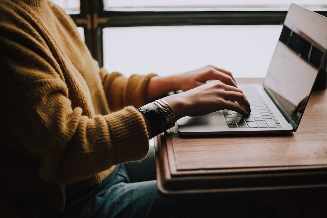 person using writing process steps sitting front of laptop